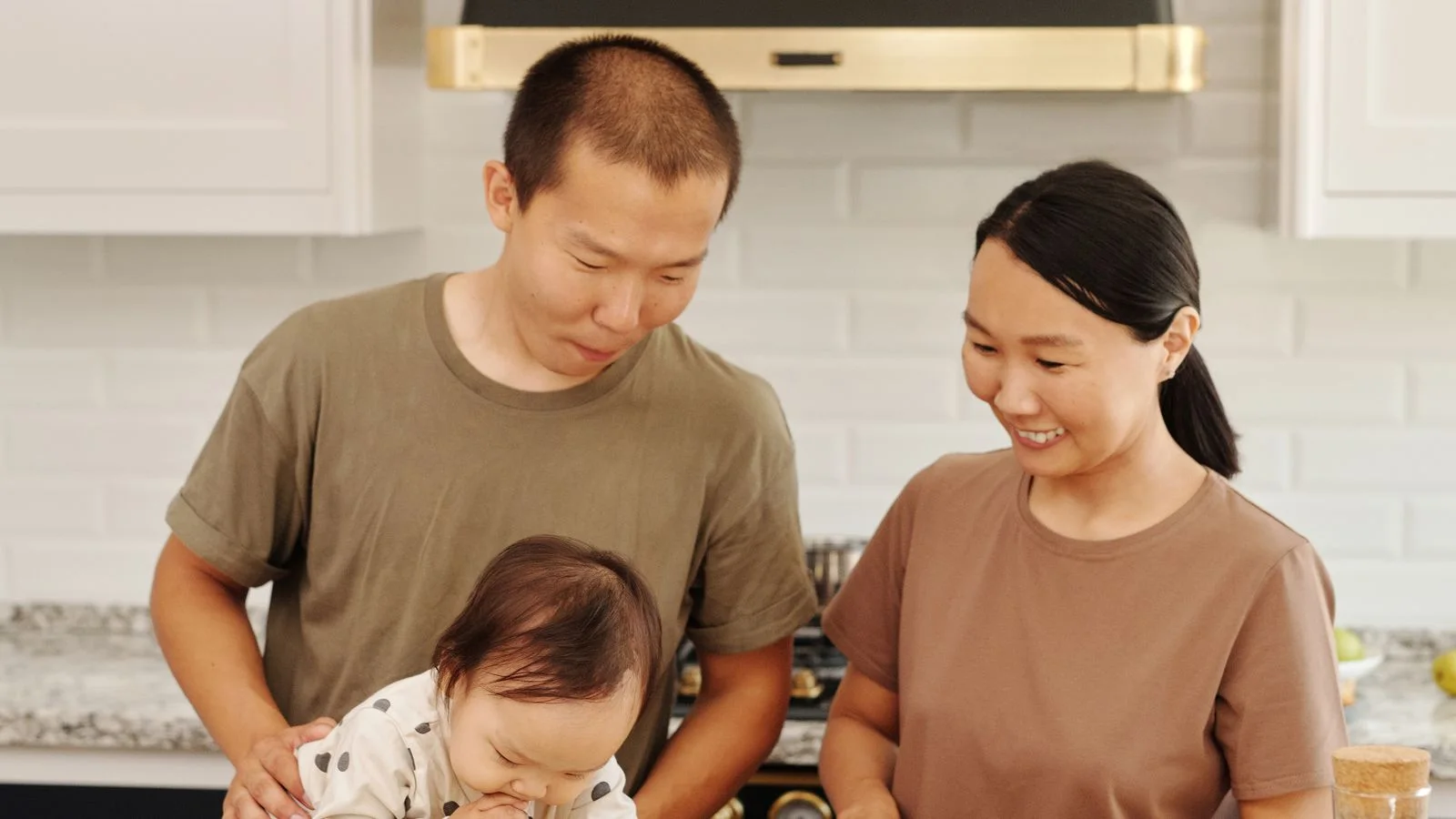 Parents and child talking together at a table