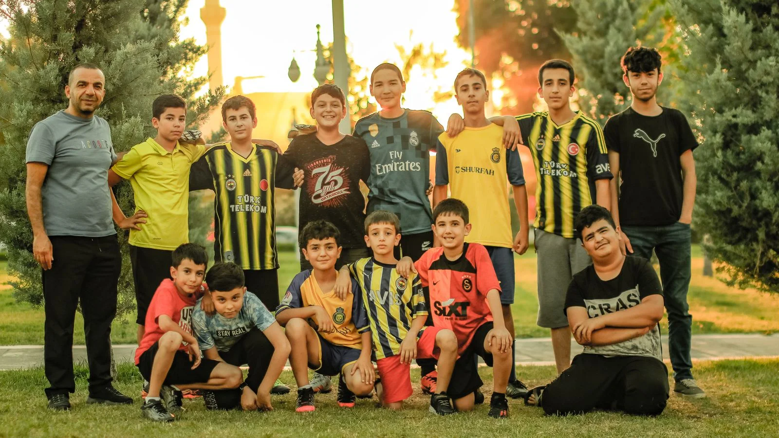 A youth sports team standing together on a playing field
